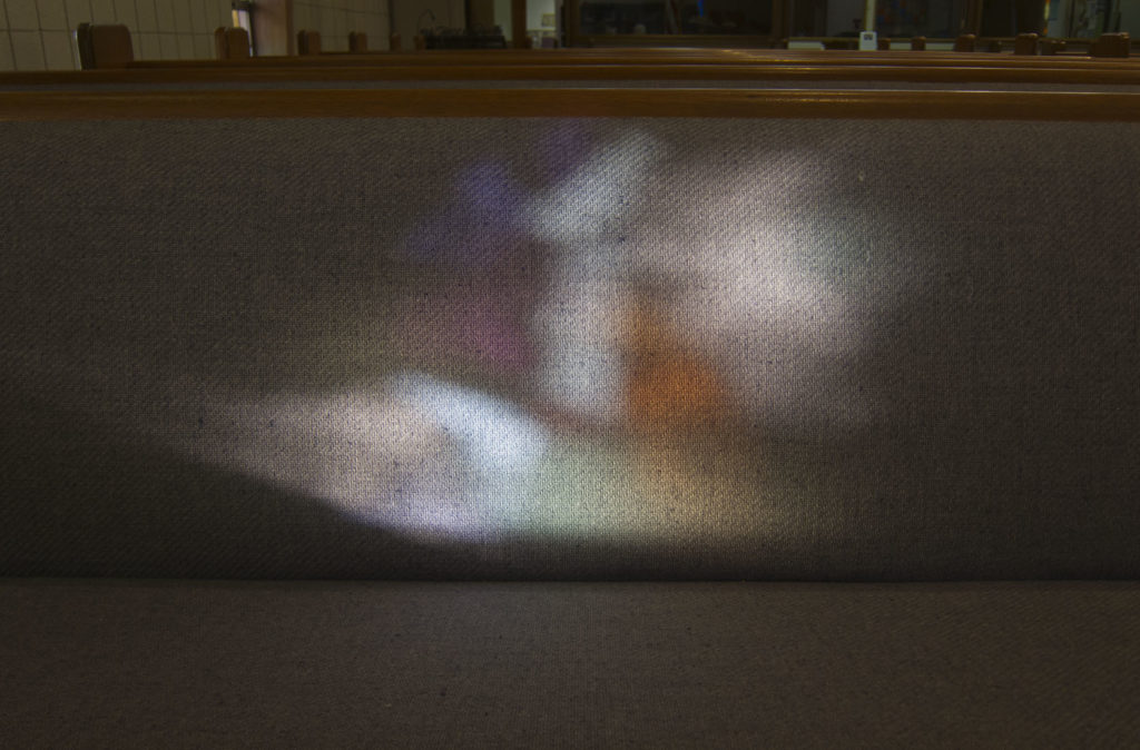 ... projected onto the pew.