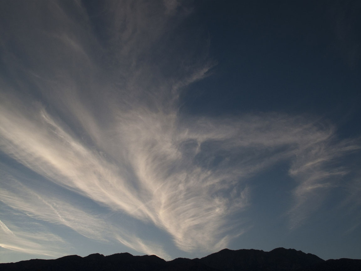 Windblown clouds after sunset